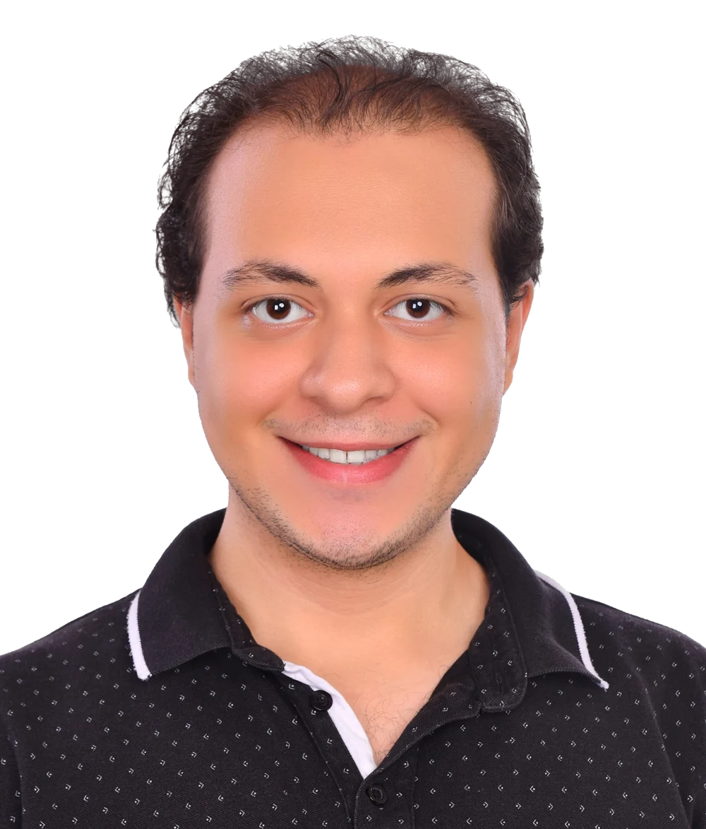 Mazen Elnaghy smiling, in a black polo shirt